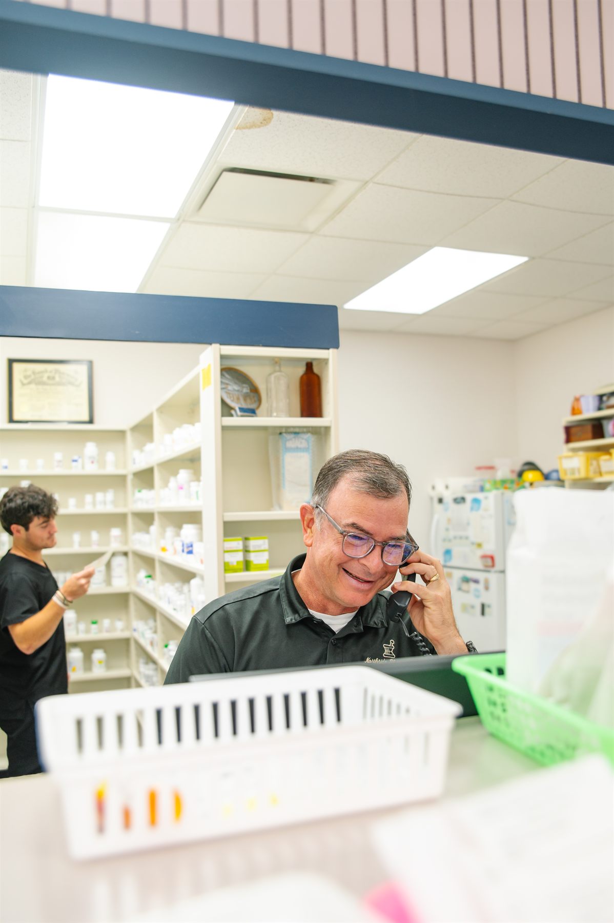 Northside pharmacist coordinating a patient's prescriptions by phone